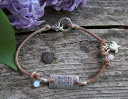 fertility bracelet with charms and leather